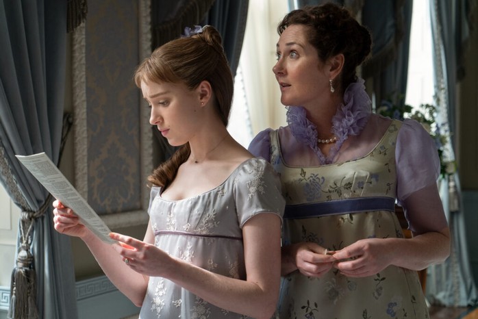 Lady Whistledown’s scandal sheet underpins almost all the action in Bridgerton. (L to R) Phoebe Dynevor as Daphne Bridgerton and Ruth Gemmell as Lady Violet Bridgerton, read Lady Whistledown's Society Papers in an episode of Bridgerton. (Image by LIAM DANIEL/NETFLIX © 2020) Phoebe Dynevor as Daphne Bridgerton and Ruth Gemmell as Lady Violet Bridgerton, read Lady Whistledown's Society Papers in an episode of Bridgerton