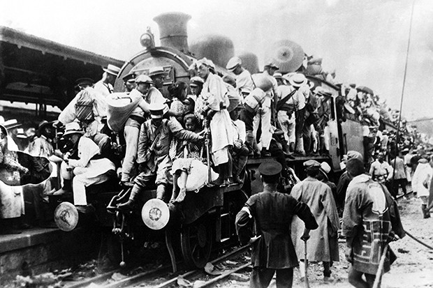 Japan: Scene of destruction in Tokyo after the Great Kanto Earthquake of 1923. Crowds of refugees struggling to board a train to escape the devastation People fleeing Tokyo by train
