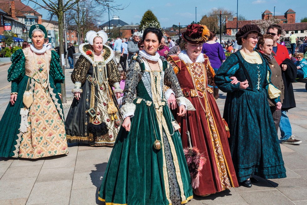Ladies in Tudor costume in Stratford-upon-Avon, Warwickshire. (Photo by Steve Vidler via Alamy) A photograph of modern day women wearing Tudor costumes.