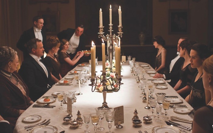 Dinner at Downton Abbey. (Photo by moviestills) A dinner scene from Downton Abbey, with large candlesticks on the table