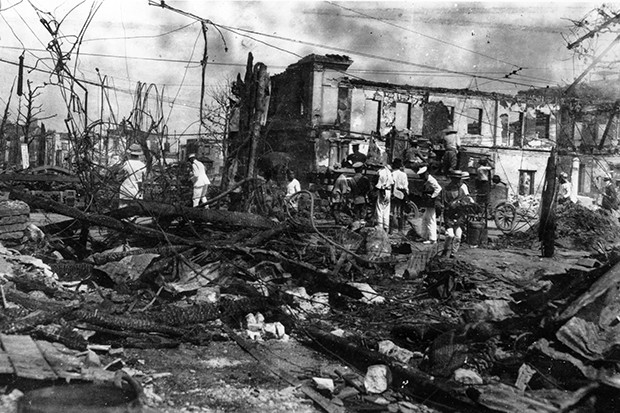 Natural Disaster Workers operate among the charred remains and skeletal shells of buildings a month after the 1923 quake