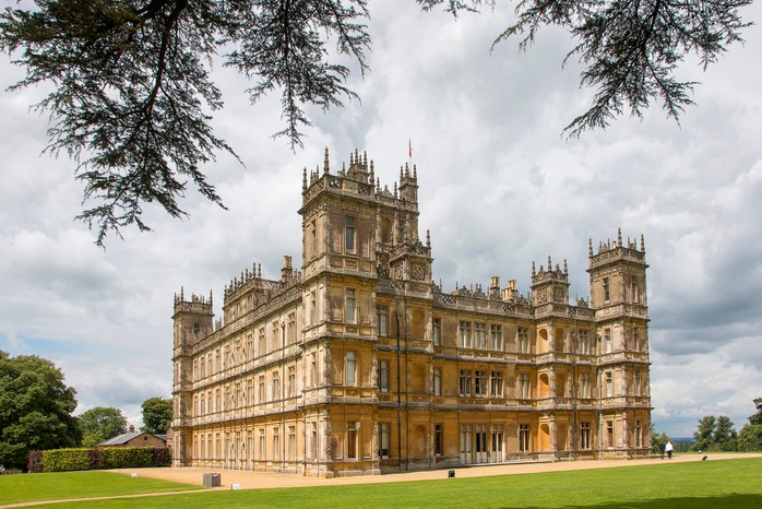 Highclere Castle was a filming location for the British period drama Downton Abbey. (Image by Getty Images) A photograph of a castle in gardens