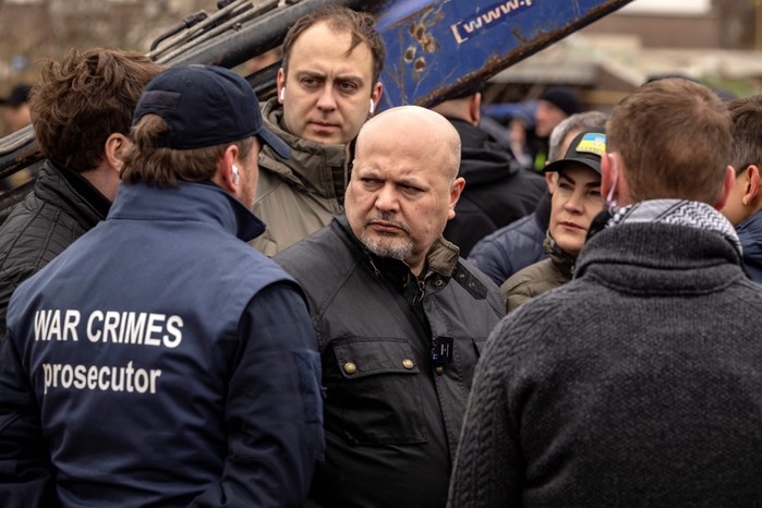 Karim Khan, chief prosecutor of the International Criminal Court (ICC), pictured centre, visits a mass grave in Bucha, on the outskirts of Kyiv, on 13 April 2022, amid Russia's military invasion of Ukraine. (Photo by Fadel Senna/AFP via Getty Images) Karim Khan, chief prosecutor of the International Criminal Court (ICC), visits a mass grave in Bucha, Ukraine